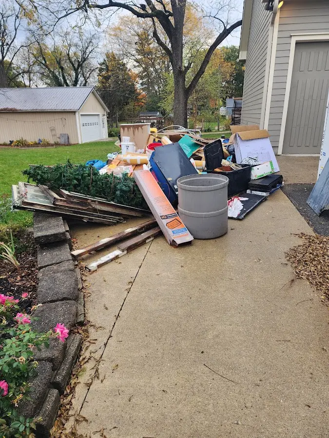 Dumpster being loaded with debris for 3 Yard Dumpster Rental in Lodi